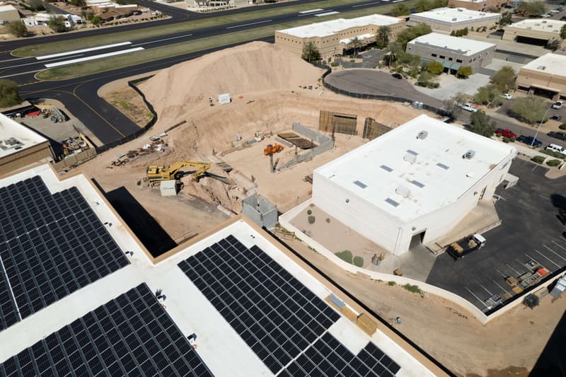 Aerial view of an excavation pit and spoil stockpile on a Diamond West commercial site in Arizona